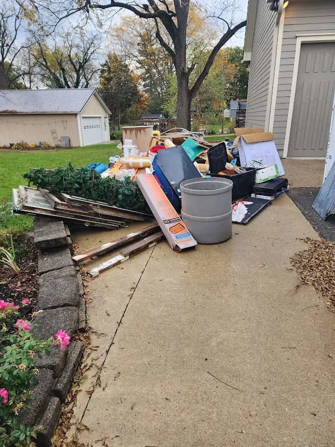 Dumpster being loaded with debris for 3 Yard Dumpster Rental in Perryville